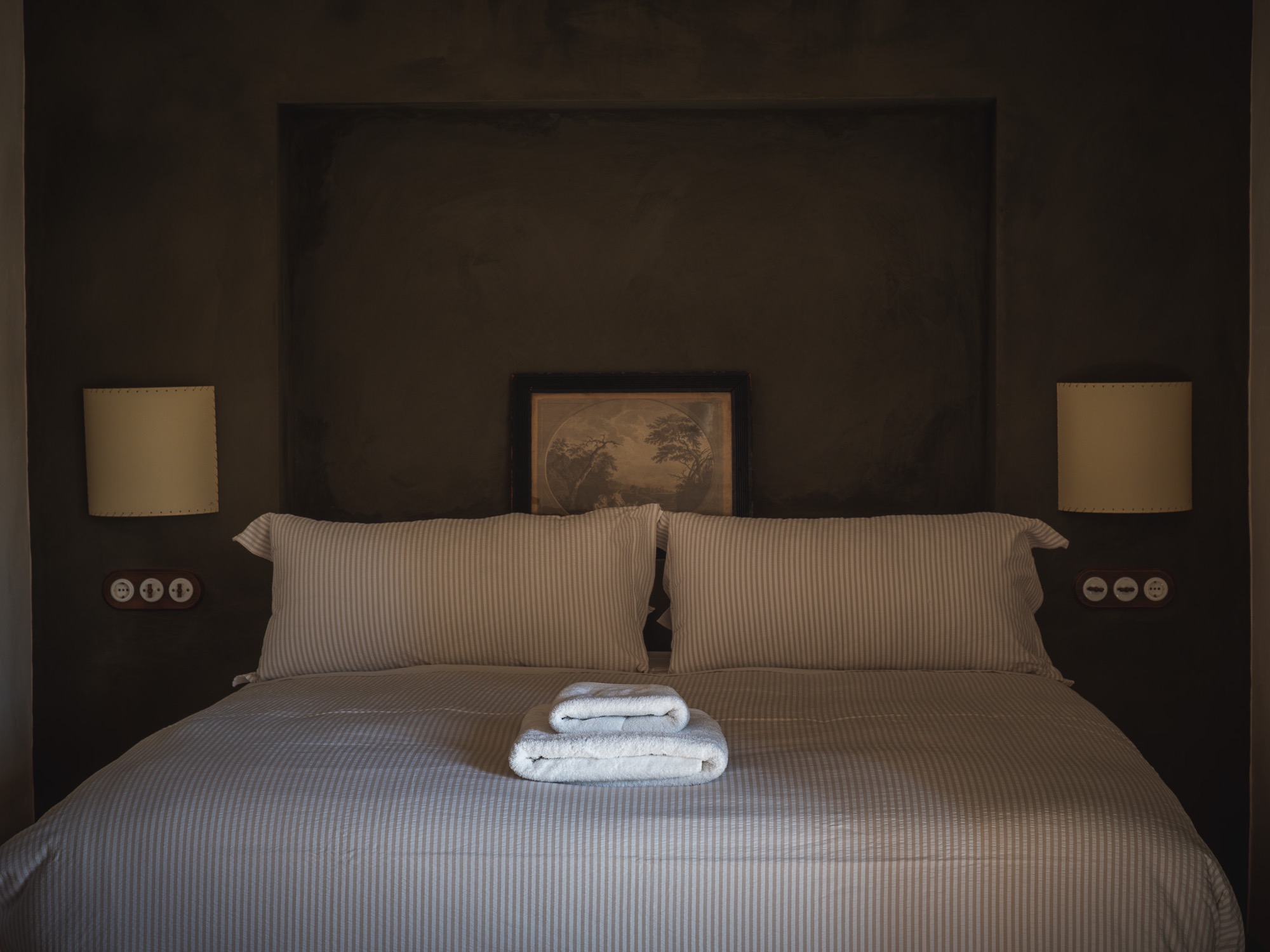 Terrace Suite king bed with striped linen